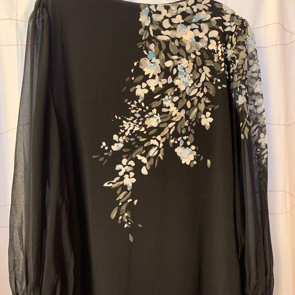 White House Black Market. Beautiful black shear sleeve blouse. New without tag.
